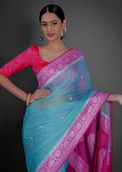 "A breezy mint Blue chiffon saree with a lightweight feel, ideal for a casual outing or daytime celebration."By Mirra Clothing