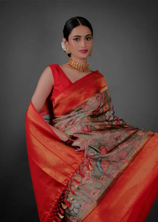 Close up view of a model showcasing Green Banarasi Silk Saree Highlighted with Kalamkari Prints , Suitable for traditional performances or fairs By Mirra Clothing