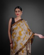 Close up view of a model showcasing Yellow Kalamkari Printed Mangalagiri Silk Saree, perfect for cultural events By Mirra Clothing