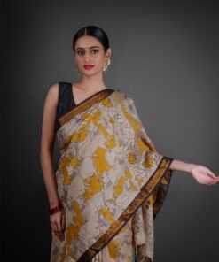 Close up view of a model showcasing Yellow Kalamkari Printed Mangalagiri Silk Saree, perfect for cultural events By Mirra Clothing