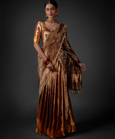 Full view of a model showcasing Molten Gold Tissue Silk Half Saree Set with Dupatta and Blouse, Suitable for special ceremonies By Mirra Clothing