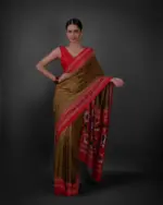 Full view of a model showcasing Moss Green Printed Georgette Saree with Chikankari Weaves , Perfect for brunch or lunch celebrations By Mirra Clothing