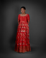 "Detailed view of the hemline of a Banarasi georgette dress, featuring ornate designs and delicate embellishments."By Mirra Clothing