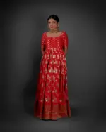 "Detailed view of the hemline of a Banarasi georgette dress, featuring ornate designs and delicate embellishments."By Mirra Clothing