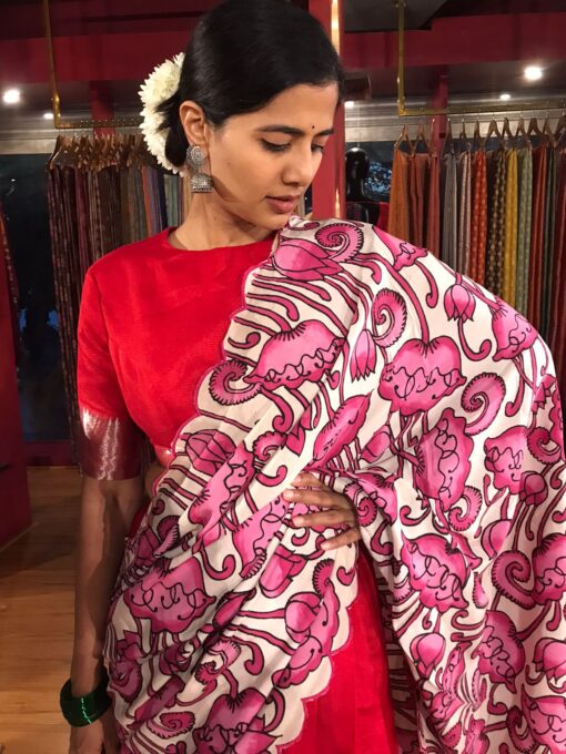 Close up view of a model showcasing Red Silk Half Saree set with cotton silk blouse and scallop dupatta, ideal for festive events By Mirra Clothing