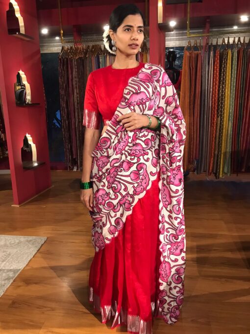 Full view of a model showcasing Red Silk Half Saree set with cotton silk blouse and scallop dupatta, tailored for cultural festivities