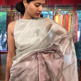 "Model posing in a beautiful ombre wine Tissue silk saree"By Mirra Clothing