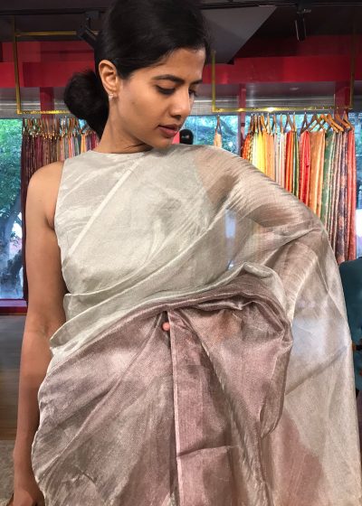 "Model posing in a beautiful ombre wine Tissue silk saree"By Mirra Clothing