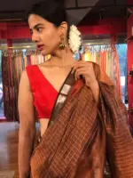 Close up view of a model showcasing Brown Mangalagiri Silk Saree with Silver Zari Checks, Suitable for Religious Ceremonies & Pujas by Mirra Clothing