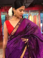 Close up view of a model showcasing Purple Mangalagiri Silk Saree Handwoven in Gold Zari Chequered Pattern, Suitable for Traditional Photoshoots & Cultural Exhibitions By Mirra Clothing