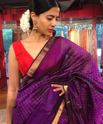 Close up view of a model showcasing Purple Mangalagiri Silk Saree Handwoven in Gold Zari Chequered Pattern, Suitable for Traditional Photoshoots & Cultural Exhibitions By Mirra Clothing