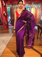 Front view of a model showcasing a Purple Mangalagiri Silk Saree Handwoven in Gold Zari Chequered Pattern, Suitable for Cultural Events & Traditional GatheringsBy Mirra Clothing