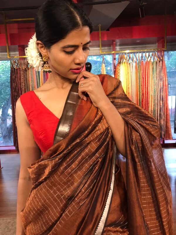 Close up view of a model showcasing Brown Mangalagiri Silk Saree with Silver Zari Checks, Suitable for Weddings & Receptions by Mirra Clothing