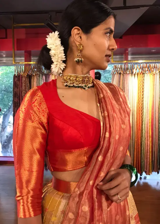 Side view of a model showcasing Yellow Semi Kanchi Silk Half Saree (Set of 3), Well-suited for Festive Gatherings By Mirra Clothing