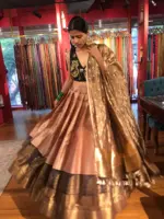 Front view of a model showcasing a Dusty Pink Half Saree Silk Lehenga Set, Composed for Festive Wear By Mirra Clothing