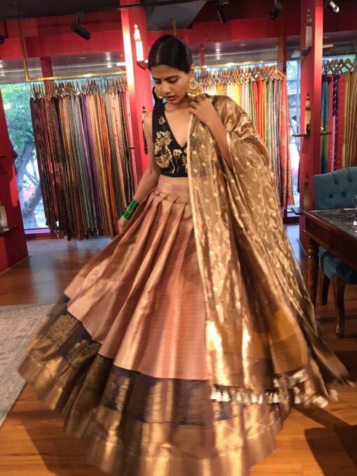Front view of a model showcasing a Dusty Pink Half Saree Silk Lehenga Set, Composed for Festive Wear By Mirra Clothing