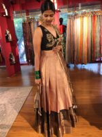 Side view of a model showcasing Dusty Pink Half Saree Silk Lehenga Set, Suitable for Festive wear By Mirra Clothing