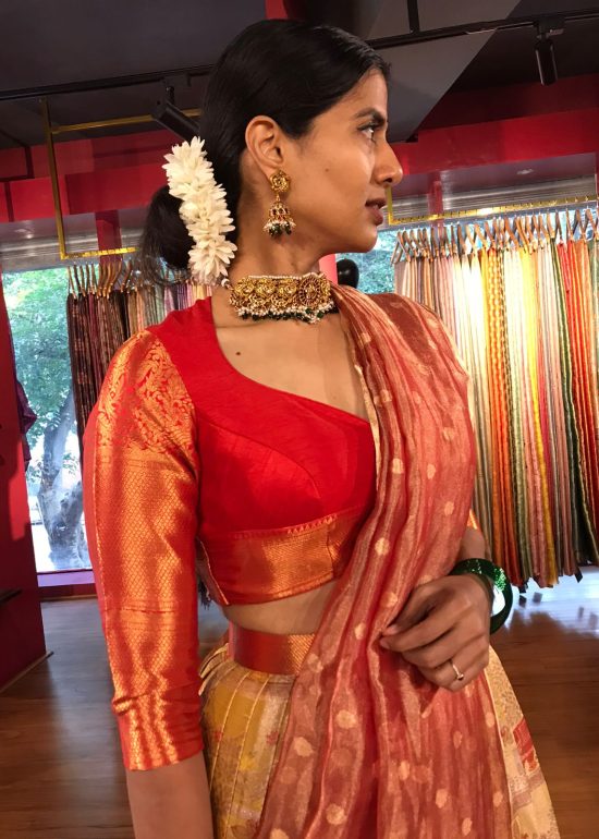 Side view of a model showcasing Yellow Semi Kanchi Silk Half Saree (Set of 2), Designed for festive wedding occasions By Mirra Clothing