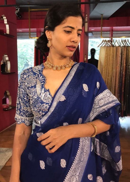 Close up view of a model showcasing Blue Khaddi Banarasi Chiffon Silk Saree with Kadwa Zari Motifs, Suitable for festive occasions By Mirra Clothing