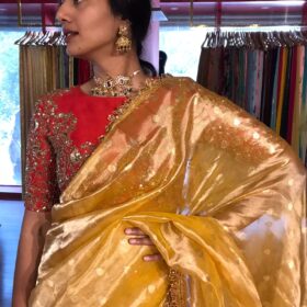 Mustard Yellow Dual Tone Tissue Silk Saree highlighted with Zari Motifs and Gota Border