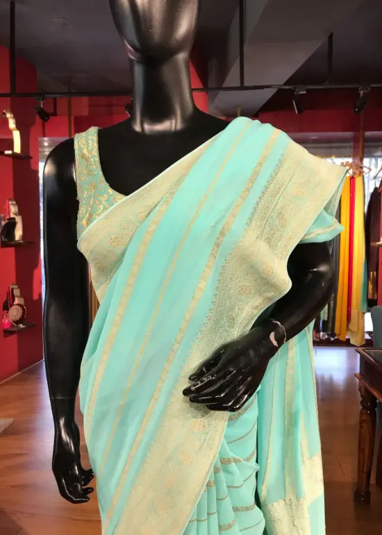 Sea Green Georgette Saree with Gold Zari Weaves