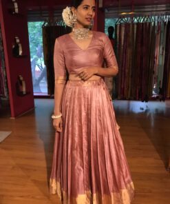 A Full view of a model showcasing a Dusty Pink Tussar Lehenga suitable for Casual wear