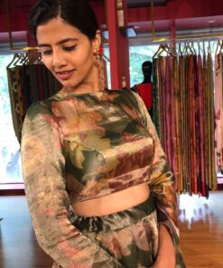 A model wearing Bottle Green Printed Tissue Silk Lehenga it can wear for wedding festival by mirra clothing