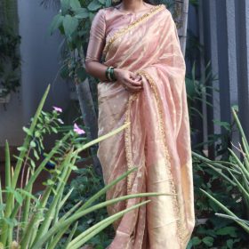 Dusty Pink Tissue Silk Saree woven with Beautiful Gold Zari Buttis