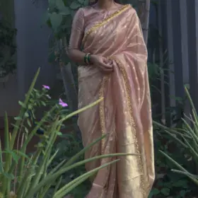 Dusty Pink Tissue Silk Saree woven with Beautiful Gold Zari Buttis